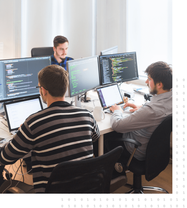 A group of employees working on migrating the client's full application layer