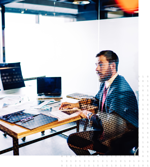 A man sitting at his desk discussing the challenge